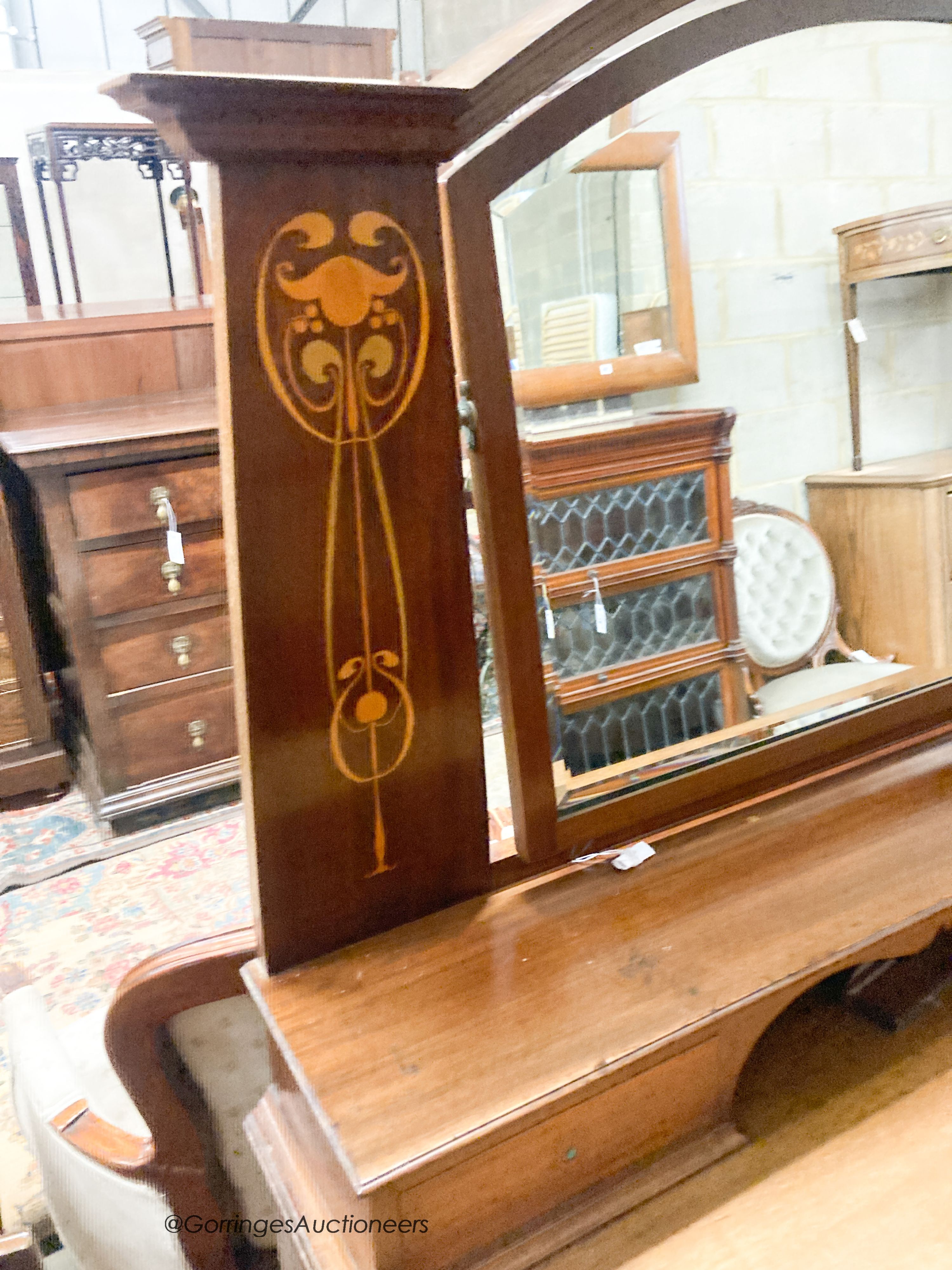 An Edwardian Art Nouveau inlaid mahogany dressing chest, width 122cm, depth 55cm, height 160cm